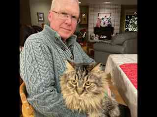 Tanker and I compete for Dad’s lap.