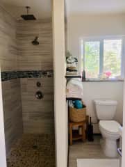 Small bathroom with open shower