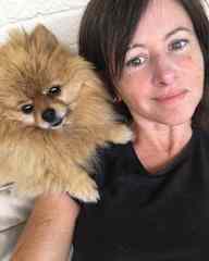 Chilling on the sofa on back porch with my Pomeranian Bear