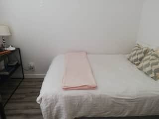Spare room with window facing the front of the house which is located on a quiet street.