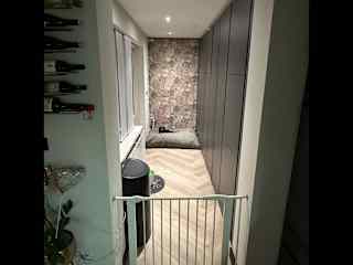 A place where the dogs like to chill behind the gate. The dogs have a catflap so they can access the garden which is complete fenced off. Also here is the washing machine and dryer.
