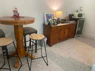 Guest area sitting with coffee and water fridge upstairs