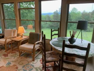 Sun Room with Dining Table and Couch