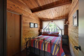 Our guest bedroom with a queen size bed and plenty of light.