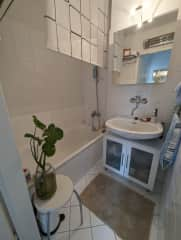 Bathroom with bathtub and shower combi