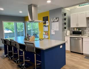 Kitchen bar with cooktop