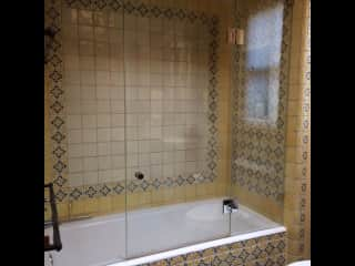 Bathroom #2 with Spanish tiled bathtub