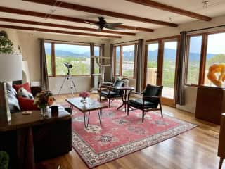 Our living room and dining room overlook the valley and the mountains.