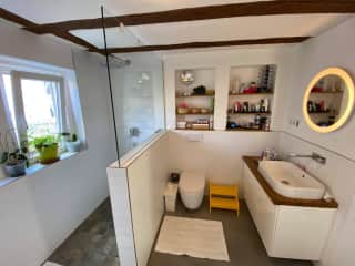 Rain shower downstairs and the main bathroom with washing machine and tumble dryer