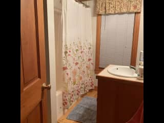 Guest bathroom. Toilet hidden behind sink.