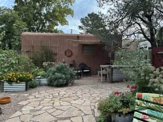 From the porch looking at seating area and garage.