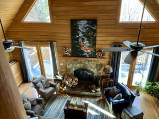 View of the living room looking down from the loft space.