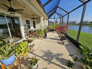 Another view of the enclosed patio and dining table.  There are two ceiling fans.  If we're gone for more than 7-10 days, I may ask for some of the plants to be watered.