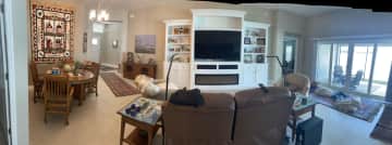 Dining area on left, living room middle, sliders to lanai on right