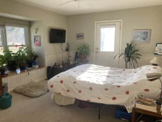 Bedroom with door to outside deck.