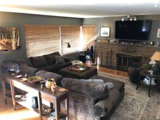 Living room with western exposure view and front deck.