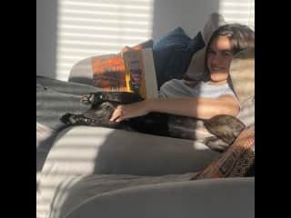 Snuggles and half reading with puppy Shupi
