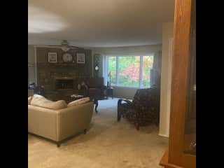 Living room with gas fireplace. Lots of Large windows to enjoy the beautiful forest and wildlife.