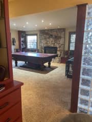 game room with gas fireplace insert