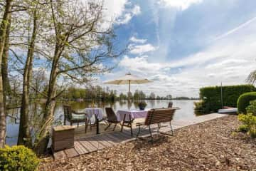 Outdoor terrace with swimming stairs on the lake