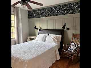 Guest bedroom with a queen bed with Tempur-pedic mattress.