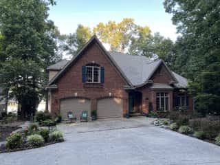 Front of house with new flower garden to the left.