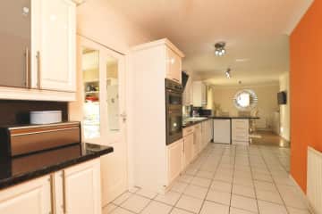 The kitchen/diner is large and fully equipped. There is a utility room and toilet leading off it