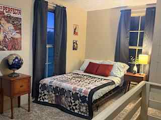 The guest room opens to the staircase, but since you'll be the only ones in the house you'll have all the privacy you need! Note this room does have a ceiling fan but no air conditioner.