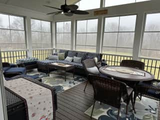 We call this space the Wine Deck! Vinyl windows slide down for the breeze in the summer!