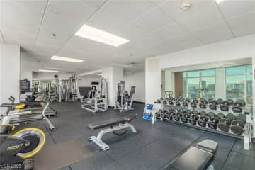 Fitness center with treadmills, free weights, and weight machines