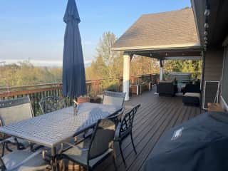South/ West facing deck with BBQ, hot tub and propane fire pit.