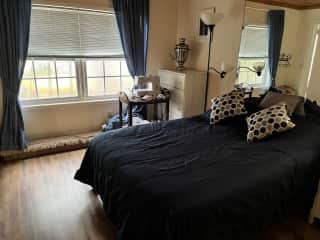 Guest bedroom with full size bed and en suite bathroom.