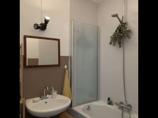 Bathroom with toilet, sink and bathtub-shower combo.