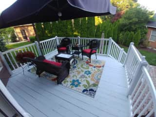 The serene outdoor space includes a deck and patio (not shown) and is a haven in the summer months!