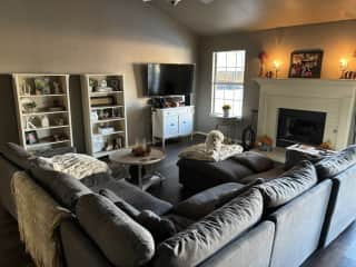 Living room with big screen TV and a very comfortable couch.