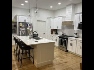 Kitchen, adjacent to the living room, on the first floor.