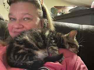 Chris. Chris showed up at my back door one day as a kitten and we adopted him. He lives with my son now.