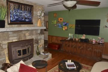 Our cozy living room has a fireplace and large screen tv.