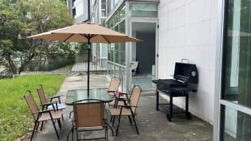 Garden with a barbecue place.