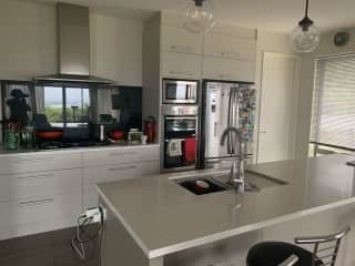 Modern kitchen with walk-in pantry.