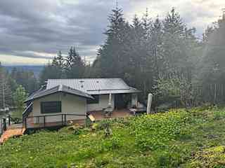 Back of property with large deck