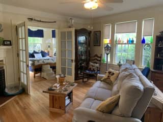 Welcome to our living room.   Gas fireplace, mounted tv, turntable/albums, central air/heat.