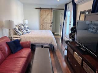 Master bedroom with large and very comfy king bed. Lots of light/windows with view of the mountains and black out (dark navy) curtains.