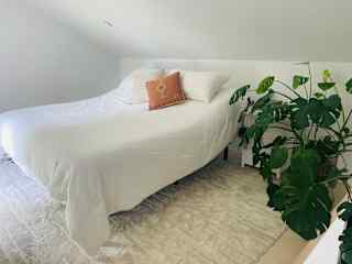 Loft bedroom with king sized adjustable bed.