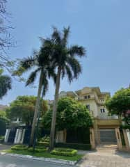 View of our house from the street with Ciputra security guards nearby.