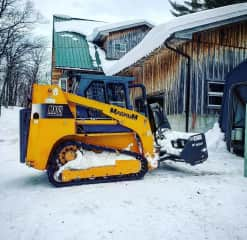 The is Magnum, the skid-steer, snow-removal machine!