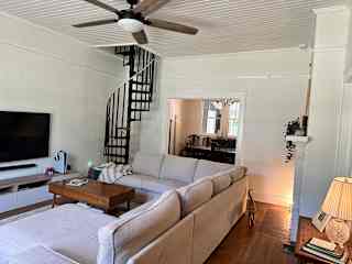 Living room with dining room behind it