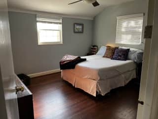 Primary bedroom. Queen sized bed and drawers for clothing storage.