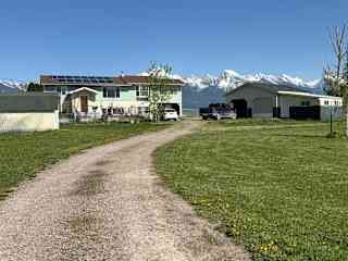 Front of house, from driveway, looking east toward Mission Mountains.
