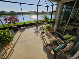 Enclosed patio with mosquito-proof screen and lake view / sunset view.  Chairs are mostly for the cats, but also humans :)